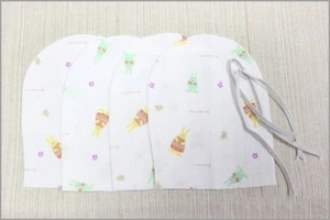 Mother stitched the gloves to prepare for the baby was born